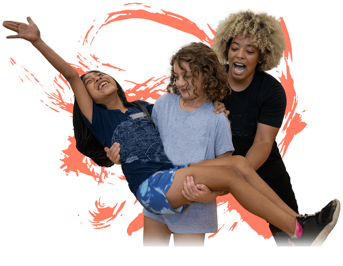 Two young kids dancing with their instructor